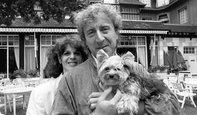 A 1984 photo of actor and director Gene Wilder posing with his wife Gilda Radner, during the 10th American Film Festival of Deauville. Wilder, who delighted audiences with his comic turns in Willy Wonka & the Chocolate Factory and several Mel Brooks classics including Blazing Saddles and The Producers, died August 29, 2016 at age 83. Photo: AFP