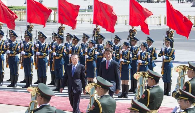 Chinese Premier Li Keqiang held a welcoming ceremony for Canadian Prime Minister Justin Trudeau before their talks in Beijing. After his stay in Beijing, Trudeau will fly to Hangzhou to attend the G20 summit. Photo: Xinhua