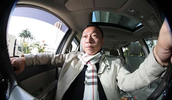 Hong Kong Uber driver William Wong Ka-lok, in his car in Sha Tin in March. Photo: Bruce Yan