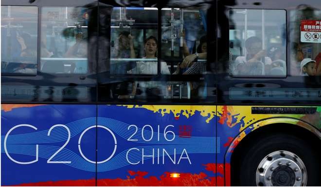 Passengers on a bus near the West Lake, Hangzhou. President Xi Jinping is set to present at the G20 summit an ambitious set of initiatives that will elevate China’s international stature. Photo: Reuters