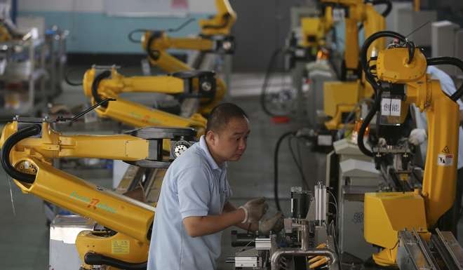 Robots have the potential to boost per capita productivity. Photo: AP