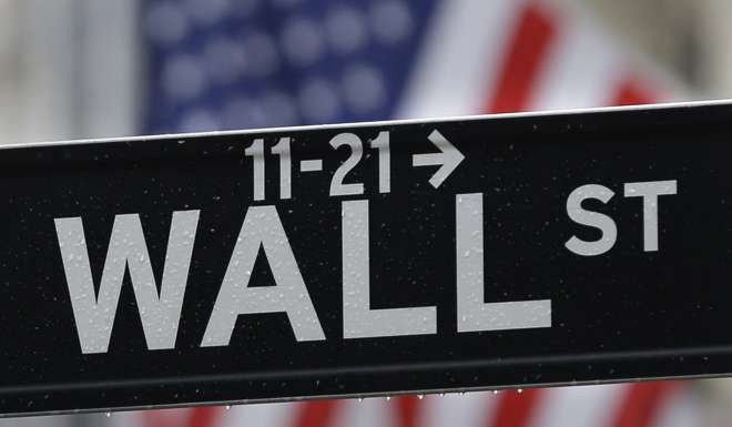 The photo shows the Wall Street sign near the New York Stock Exchange as traders digested the August job report. Photo: AP