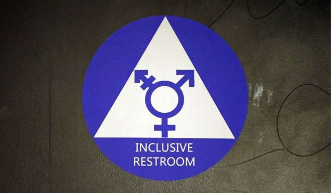 A sticker used in a Seattle high school that designates a gender-neutral bathroom. Photo: AP