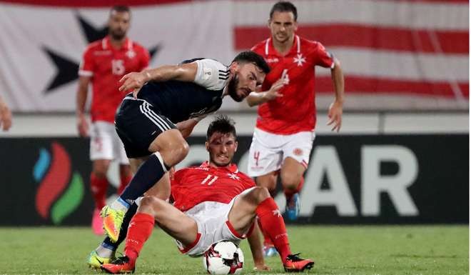 Snodgrass’s hat-trick helped send Scotland top of group F after one match of the campaign. Photo: EPA