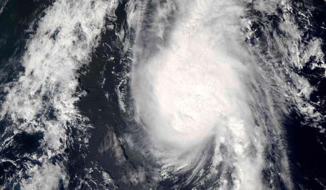 A NASA satellite image shows Typhoon Namtheun (15W) over Japan in September 2016. The typhoon is bearing down on the country's main island of Kyushu in the southwest on the heels of Typhoon Lionrock that killed 17 people. Photo: AFP