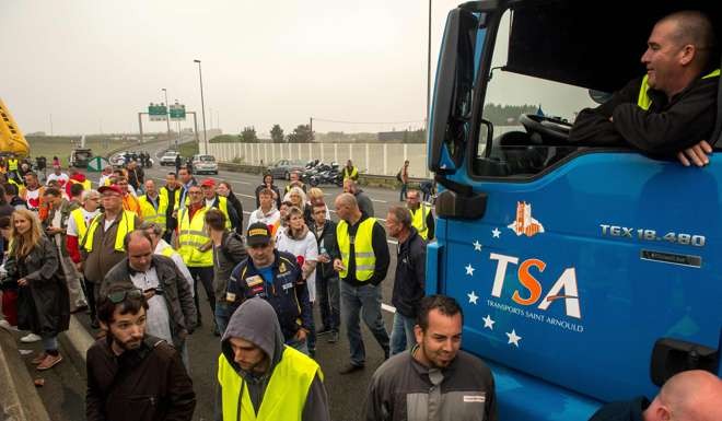 French truckers and farmers block the main routes in and out of the port of Calais on Monday. Photo: AFP