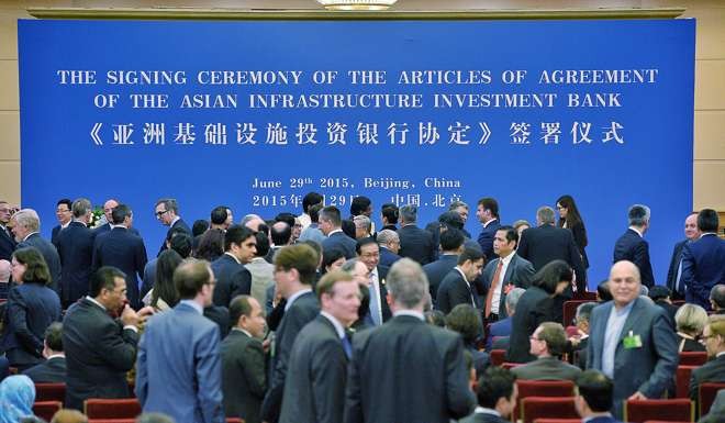 Representatives of more than 57 countries attend the signing ceremony of the AIIB articles of agreement in Beijing on June 29 last year. Photo: Xinhua