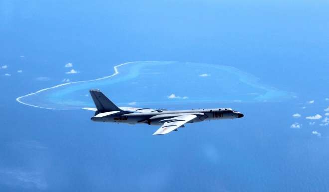 In this undated file photo released by Xinhua, a Chinese H-6K bomber patrols islands and reefs in the South China Sea. Photo: AP