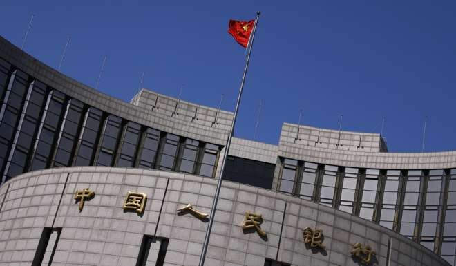 The People's Bank of China headquarters in Beijing. The central bank loosened rules on cash reserves as of March to boost cheap loans. Photo: Reuters