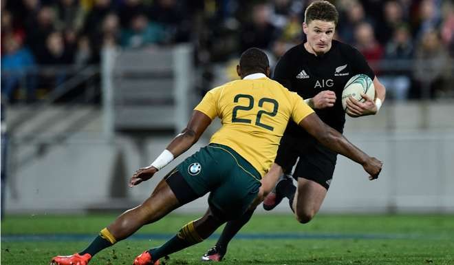 New Zealand's Beauden Barrett (right) is tackled by Australia's Reece Hodge. Photo: AFP