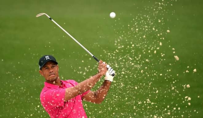 Tiger Woods of the US hitting out of the sand at Augusta National Golf Club in Augusta, Georgia during a practice round for the 2015 Masters Golf Tournament. Photo: AFP