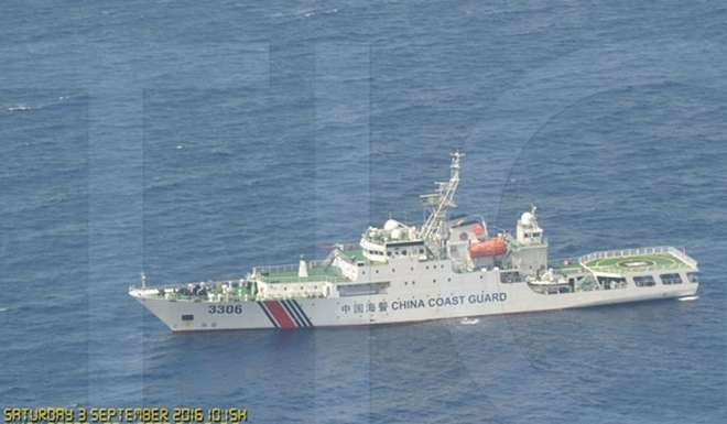 A watermarked image provided by the Philippines purports to show one of many Chinese vessels filmed during an overflight by a Philippine Air Force plane near Scarborough Shoal in the South China Sea on September 3. Photo: EPA