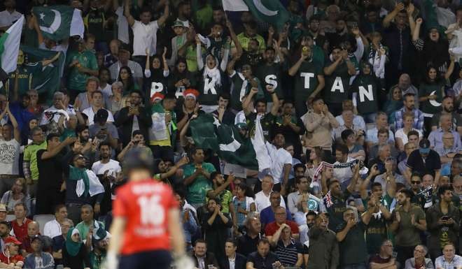 England's Eoin Morgan walks off after being caught by Pakistan's Sarfraz Ahmed. Photo: Reuters