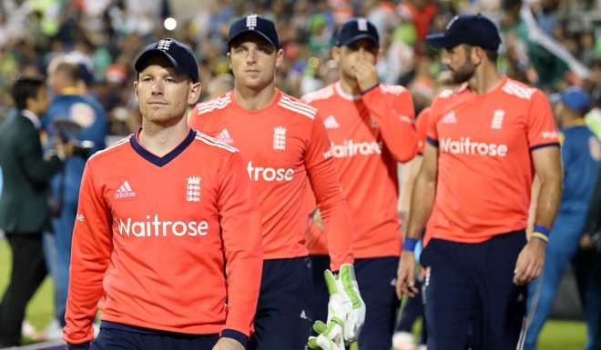 England's Eoin Morgan leads his players off the pitch after losing against Pakistan. Photo: AP