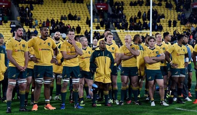 Australia watch as the Bledisloe cup is presented to New Zealand. Photo: AFP