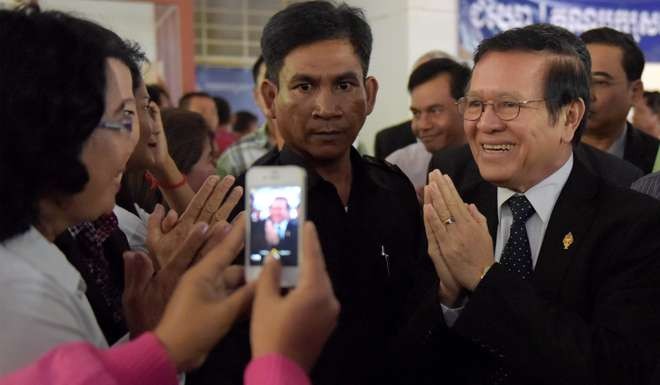 Cambodian opposition party deputy leader Kem Sokha greets supporters at the Cambodia National Rescue Party (CNRP) headquarters in Phnom Penh. Photo: AFP