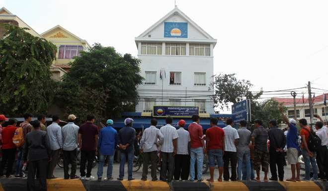 Supporters of the Cambodia National Rescue Party (CNRP), in front of the CNRP headquarters. Photo: Reuters