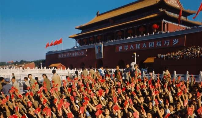 Red Guards wave ‘little red books’ at Beijing’s Tiananmen Square as Chairman Mao Zedong meets them in 1966. Photo: China Foto Press