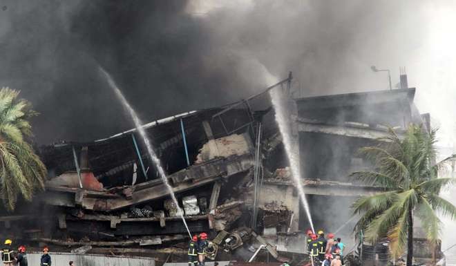 Firefighters tackle flames after an explosion in a factory in Bangladesh on September 10. Photo: EPA