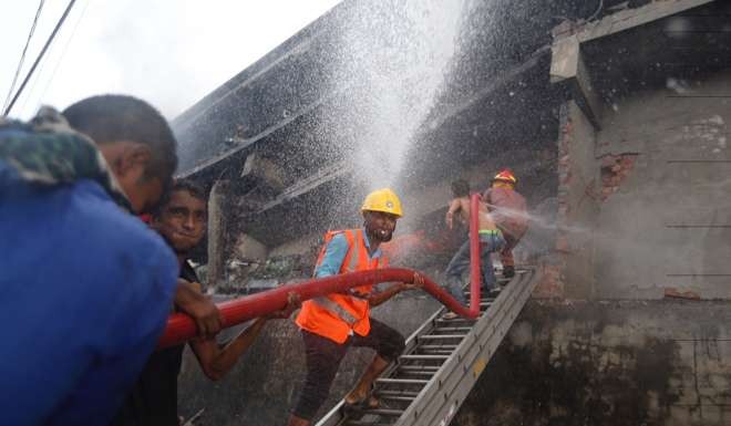 Firefighters work to put out a fire at a packaging factory in Tongi industry area outside Dhaka. Photo: AP