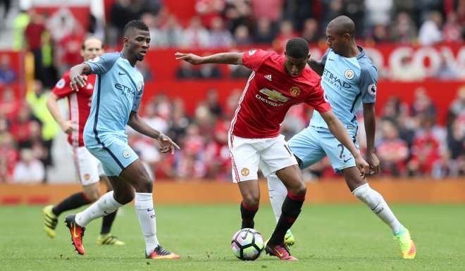 Manchester United's Marcus Rashford battles for the ball with Manchester City's Kelechi Iheanacho and Fernandinho. Photo: AP