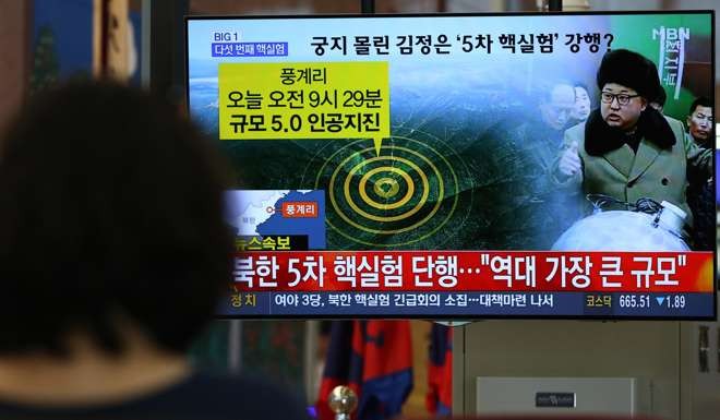 A woman in Busan, South Korea watches a TV news report of Friday’s nuclear test. Photo: Bloomberg
