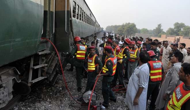 Rescue workers prepare to search a train after two trains collided. Photo: Reuters
