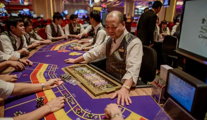 A Sands casino employee during training in Macau. Photo: AFP
