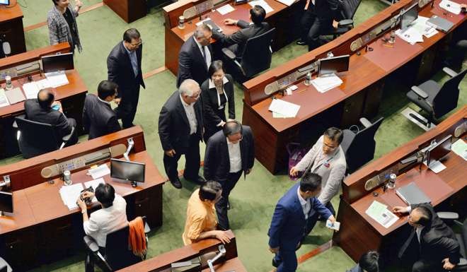 Pro-establishment lawmakers leave the Legislative Council on June 18 last year ahead of a vote on the Beijing-backed electoral reform package for the city’s leadership race in 2017. Photo: Kyodo