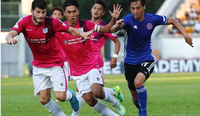 Kitchee's Pau Bosch and Huang Yang try to keep possession of the ball from Eastern’s Lee Hong-lim, who had a brilliant game.
