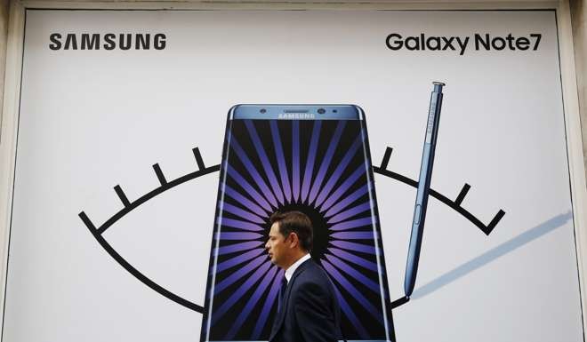 A man walks past an advertisement for the Samsung Galaxy Note 7. Photo: Reuters