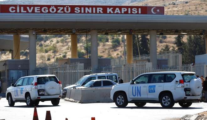 UN vehicles enter Syria from Turkey at Cilvegozu border gate. Photo: Reuters