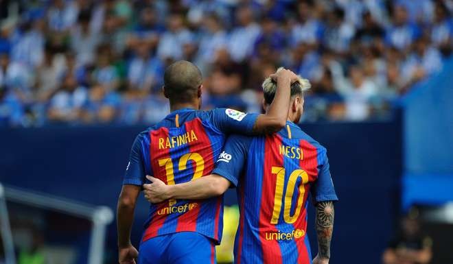 Barca’s Rafinha and Lionel Messi celebrate a goal. Photo: AFP