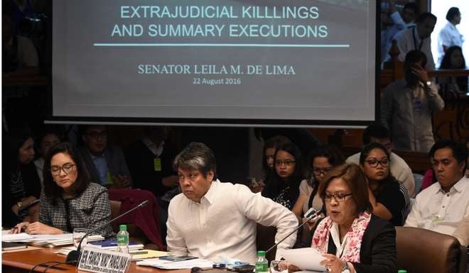 Senator Leila De lima speaks at the start of the senate inquiry into the country’s extra judicial killings. Photo: AFP