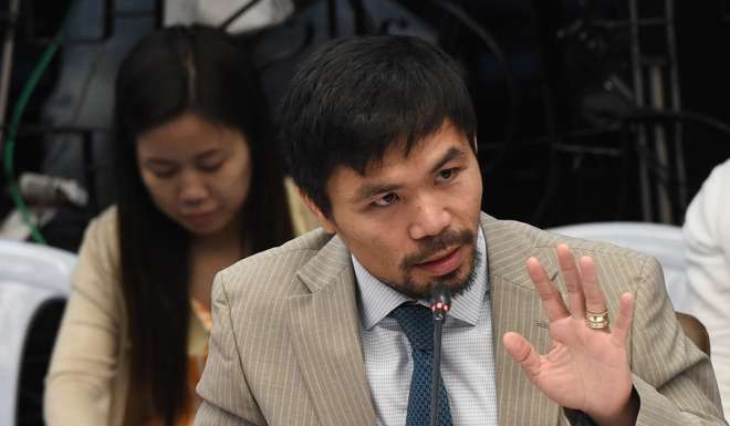 The motion to oust de Lima was put forward by senator and boxer Manny Pacquiao. Photo: AFP