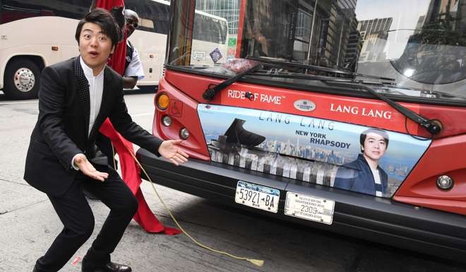 Pianist Lang Lang reacts as he is inducted into the prestigious Ride of Fame in celebration of his role as New York City's first Cultural Tourism Ambassador on September 20, 2016 in New York. Photo: AFP