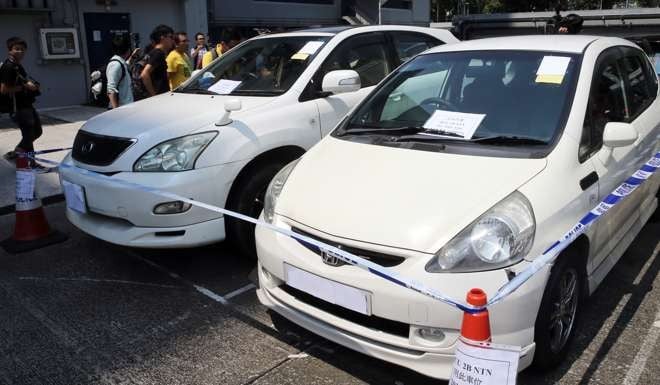 Two vehicles allegedly used by the suspects linked to death threats received by legislator-elect Eddie Chu Hoi-dick. Photo: Sam Tsang