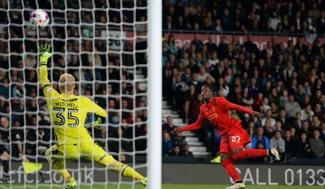 Divock Origi scores Liverpool’s third goal against Derby County. Photo: AP