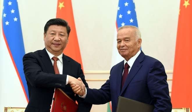 Chinese President Xi Jinping (left) and Uzbek President Islam Karimov sign a joint statement after talks in Tashkent, Uzbekistan in June. Photo: Xinhua