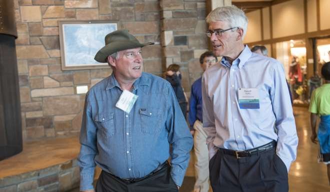 Eric Rosengren, president and chief executive officer of the Federal Reserve Bank of Boston, left, and Darrell Duffie, professor of finance at the Stanford University Graduate School of Business, arrive for a western themed dinner during the Jackson Hole economic symposium. Photo: Bloomberg