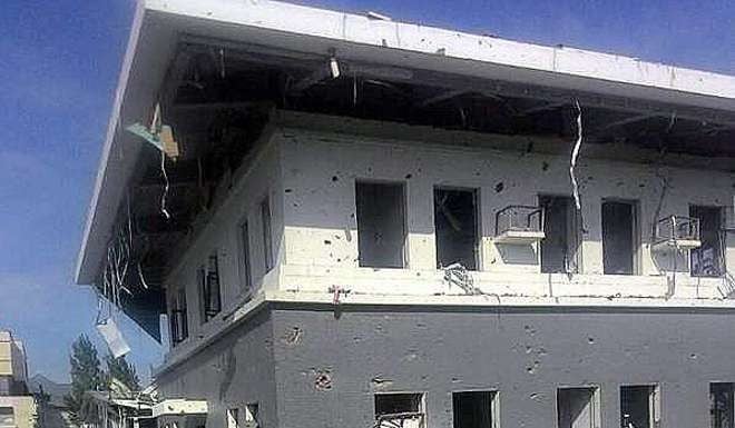 Damage at the Chinese embassy in the aftermath of the attack in Bishkek. Photo: EPA