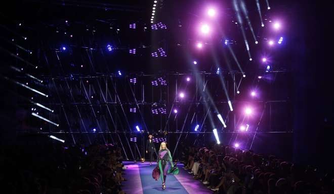 A Bladerunner backdrop to match Versace’s high-tech urban looks. Photo: AP