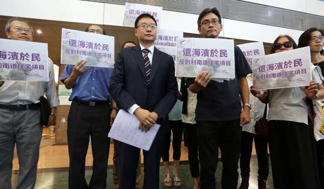 Legislator Kenneth Chan Ka-lok (centre left) with South Horizons residents outside the Town Planning Board’s office in North Point on Tuesday. Photo: Jonathan Wong