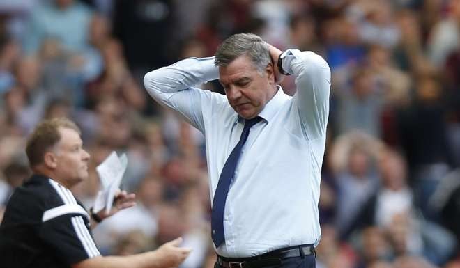The then West Ham United's manager Sam Allardyce holds his head as his player missed a chance to score against Tottenham Hotspur during their English Premier League soccer match. Photo: AP