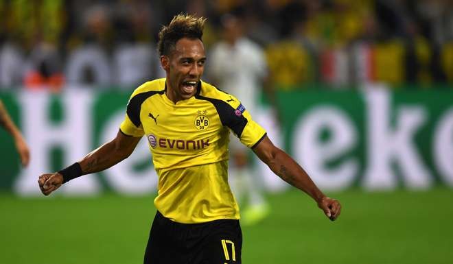 Dortmund's Gabonese striker Pierre-Emerick Aubameyang celebrates during the UEFA Champions League first leg football match between Borussia Dortmund and Real Madrid at BVB stadium in Dortmund, on September 27, 2016. / AFP PHOTO / PATRIK STOLLARZ