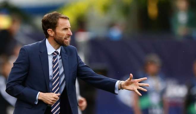 In this June 21, 2015 file photo, England's Under 21 coach Gareth Southgate gives instructions to his players during the Euro U21 soccer championship group B match between Sweden and England, at the Ander stadium in Olomouc, Czech Republic, Sunday. Gareth Southgate, the manager of England's under-21 side, will take charge of the senior team's next four matches, against Malta, Slovenia, Scotland and Spain, while the FA searches for a new coach.(AP Photo/Matthias Schrader, file)