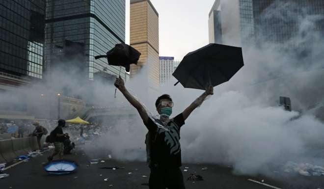 Police fired tear gas at protesters in Hong Kong on September 28, 2014, at the start of the Occupy movement. Photo: Reuters
