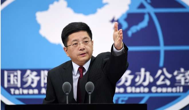 Ma Xiaoguang, a spokesperson for the Taiwan Affairs Office of the State Council, attends a press conference in Beijing. On balance, China would benefit from returning to its previous repatriation policy. Photo: Xinhua