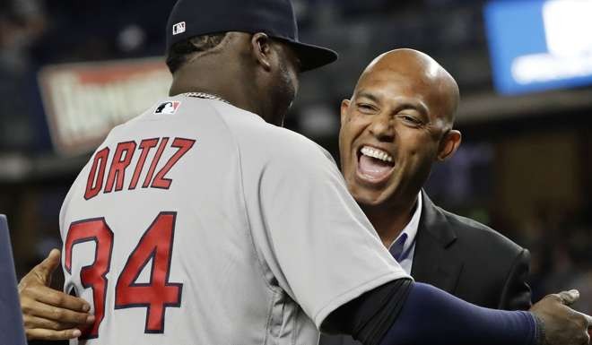 Boston Red Sox's David Ortiz is greeted by former New York Yankees pitcher Mariano Rivera as he is honoured before Boston's baseball game against the Yankees. Photo: AP