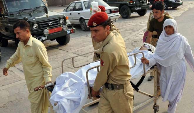 Pakistani soldiers carry an injured Malala Yousafzai, 14, at an army hospital in Peshawar on October 9, 2012. Picture: AFP